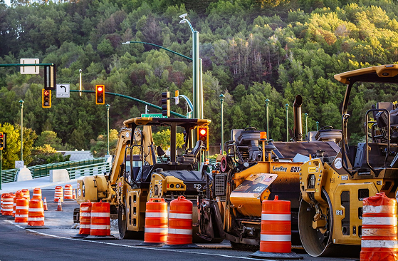 Thanks to SmartComment’s specially-designed government workflow software, complex road projects are more streamlined as shown with heavy machinery lined up neatly for construction on a forest road